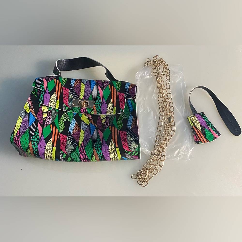 Multi color small cross body bag. Bought at the art festival but never use.